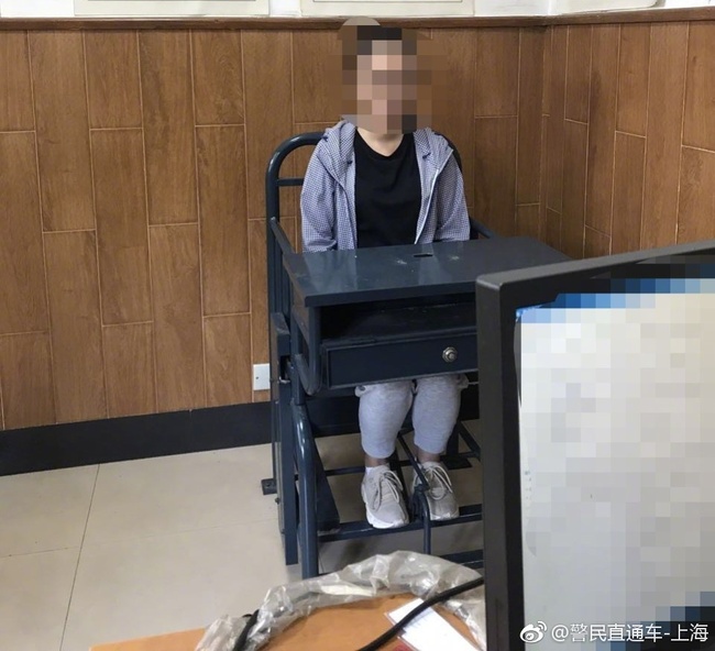 Photo shows the creator of "comfort women" emojis being questioned by police in Shanghai. [Photo: weibo.com]