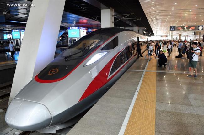 Photo taken on June 26, 2017 shows the China's new bullet train "Fuxing" at Beijing South Railway Station in Beijing, capital of China. China's next generation bullet train "Fuxing" debuted on the Beijing-Shanghai line on Monday. A CR400AF model departed Beijing South Railway Station at 11:05 a.m. for Shanghai. At the same time, the CR400BF model left Shanghai Hongqiao Railway Station for Beijing. The new bullet trains, also known as electric multiple units (EMU), boast top speeds of 400 kilometers an hour and a consistent speed of 350 kilometers an hour.[Photo: Xinhua]