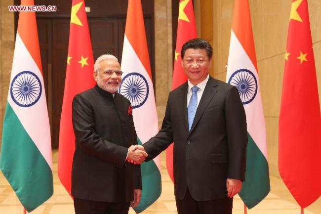 Chinese President Xi Jinping (R) meets with visiting Indian Prime Minister Narendra Modi in Xi'an, capital of northwest China's Shaanxi Province, May 14, 2015.[Photo: Xinhua]