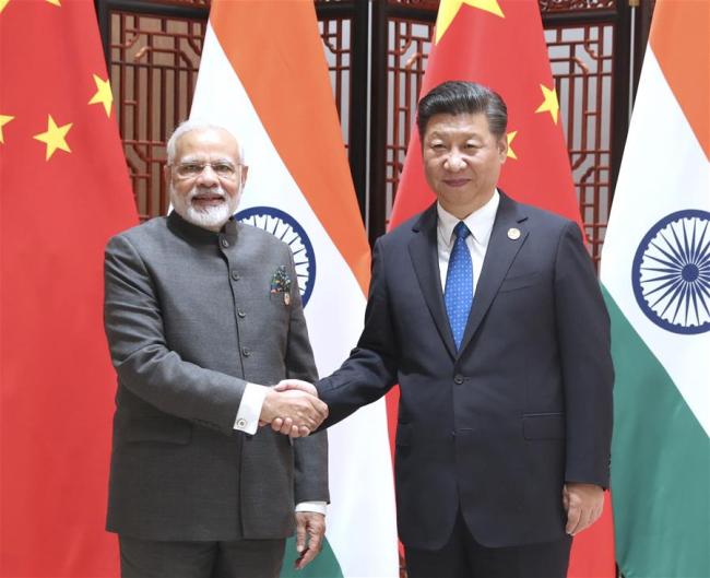 Chinese President Xi Jinping meets with Indian Prime Minister Narendra Modi in Xiamen, southeast China's Fujian Province, Sept. 5, 2017. Modi came to Xiamen to attend the ninth BRICS summit and the Dialogue of Emerging Market and Developing Countries. [Photo: Xinhua]