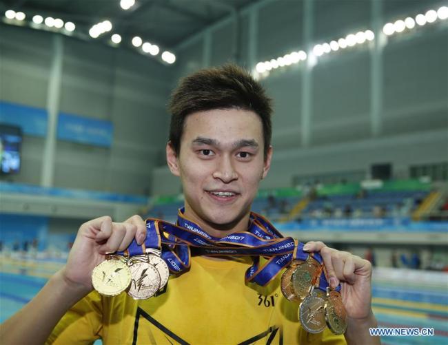 Sun Yang of Zhejiang shows all his medals after the awarding ceremony of men's 4x100m medley relay final at 13th Chinese National Games in north China's Tianjin Municipality, Sept. 7, 2017. Sun Yang won six gold medals and one silver medal at 13th Chinese National Games. [Photo: Xinhua/Fei Maohua]
