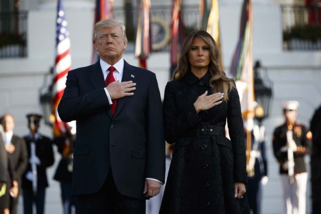 President Donald Trump and first lady Melania Trump stand for a moment of silence to mark the anniversary of the Sept. 11 terrorist attacks, on the South Lawn of the White House, Monday, Sept. 11, 2017, in Washington. [Photo: AP]