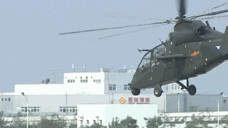 Two Chinese military helicopters perform an in-air stunt at an expo in north China's Tianjin Municipality on Thursday, September 14, 2017. [Photo: CGTN]