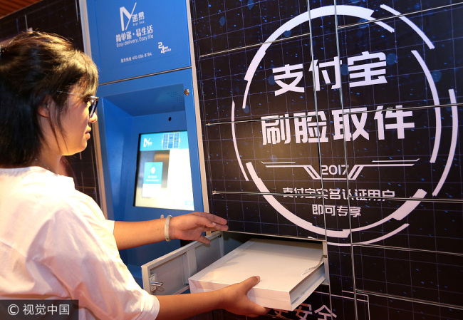 A consumer experiences the facial recognition technology in Shanghai on September 14, 2017. [Photo: VCG]