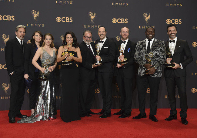Gary Cole from left, Clea DuVall, Anna Chlumsky, Julia Louis-Dreyfus, Kevin Dunn, Tony Hale, Matt Walsh, Sam Richardson, and Reid Scott pose in the press room with the award for outstanding comedy series for "Veep" at the 69th Primetime Emmy Awards on Sunday, Sept. 17, 2017, at the Microsoft Theater in Los Angeles. [Photo: Invision/AP/Jordan Strauss]