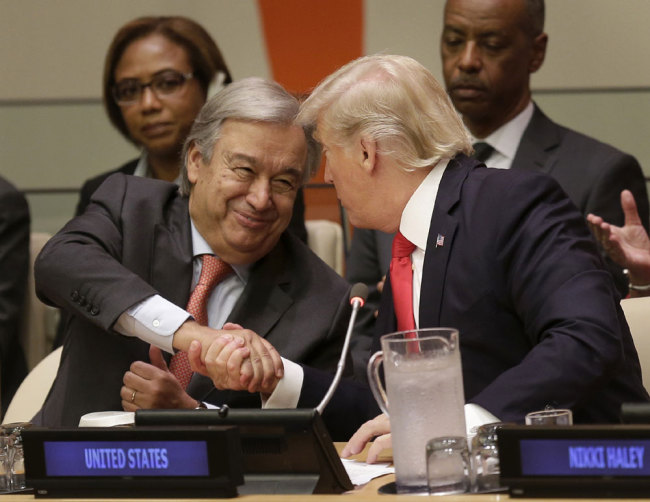 United States President Donald Trump, right, shakes hands with United Nations Secretary-General Antonio Guterres at a meeting during the United Nations General Assembly at U.N. headquarters, Monday, Sept. 18, 2017. [Photo: AP/Seth Wenig] 