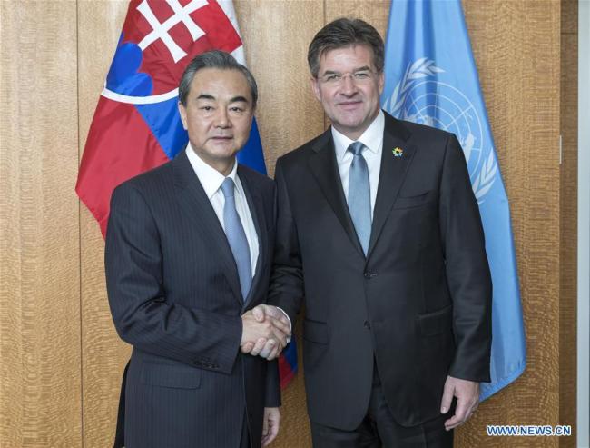 Chinese Foreign Minister Wang Yi (L) shakes hands with the President of the 72nd United Nations General Assembly Miroslav Lajcak during their meeting at the headquarters of the United Nations in New York, on Sept. 18, 2017.[Photo: Xinhua]