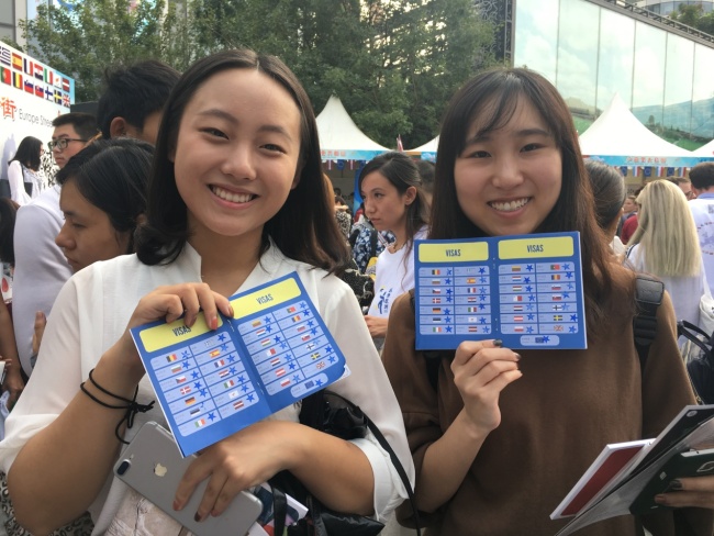 Visitors show their "EU passports" at the "Europe Street" event held on Saturday, September 23, 2017 in Beijing. [Photo provided to China Plus]