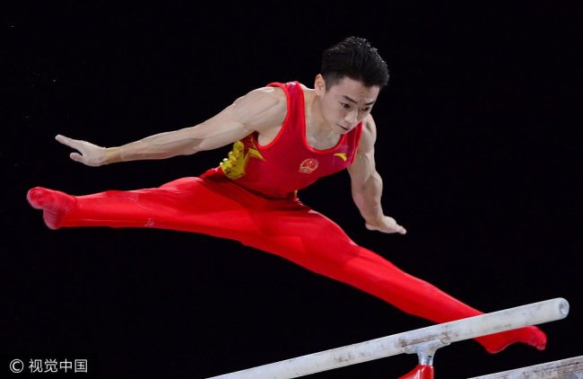Zou Jingyuan performs his gold medal-winning routine during the parallel bars portion of the Artistic Gymnastics World Championships in Montreal on Sunday, October 8, 2017. [Photo: VCG]