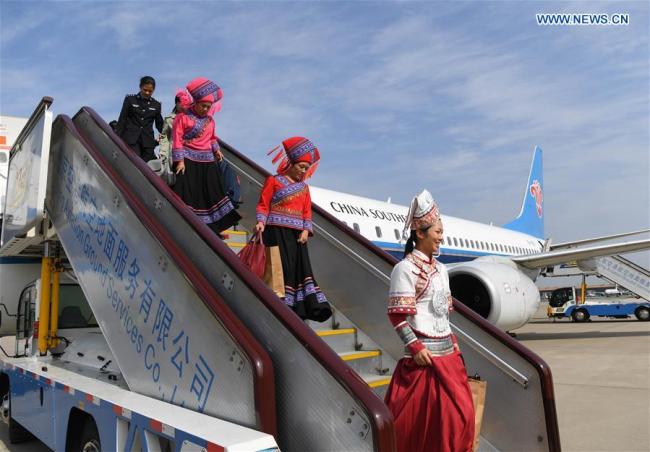 Delegates of Guangxi Zhuang Autonomous Region to the 19th National Congress of the Communist Party of China (CPC) arrive at Capital International Airport in Beijing, capital of China, Oct. 16, 2017. The congress will start on Oct. 18 in Beijing. [Photo: Xinhua]