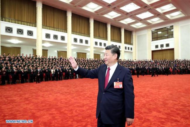  Xi Jinping, general secretary of the Communist Party of China (CPC) Central Committee, meet s with more than 2,700 delegates, specially invited delegates and non-voting participants of the 19th CPC National Congress in Beijing, on October 25, 2017. [Photo: Xinhua]