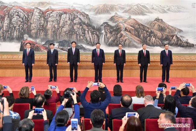 Xi Jinping (C), general secretary of the Central Committee of the Communist Party of China (CPC), and the other newly-elected members of the Standing Committee of the Political Bureau of the 19th CPC Central Committee Li Keqiang (3rd R), Li Zhanshu (3rd L), Wang Yang (2nd R), Wang Huning (2nd L), Zhao Leji (1st R) and Han Zheng, meet the press at the Great Hall of the People in Beijing, capital of China, Oct. 25, 2017.[photo: Xinhua]