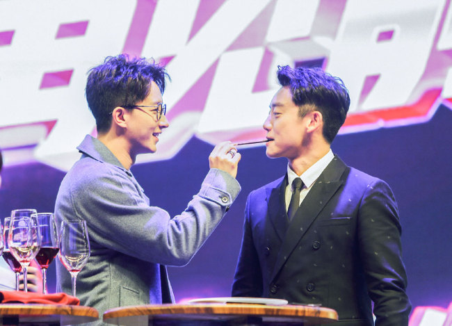 Actor Han Geng (left) and Zheng Kai (right) attend a promotional event in Beijing for their upcoming film "Ex-file, The return of the Exes" on Oct 27, 2017. [Photo: China Plus]