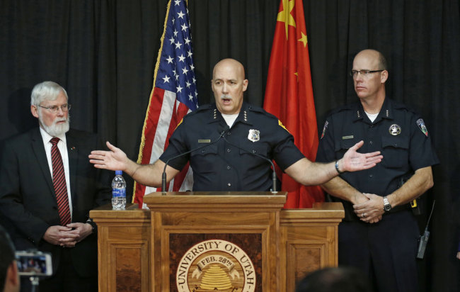 Salt Lake City Police Chief Mike Brown, center, speaks to reporters as University of Utah President David W. Pershing, left, and University of Utah Police Chief Dale Brophy, look on durning a news conference Tuesday, Oct. 31, 2017, in Salt Lake City. A fatal carjacking attempt near the University of Utah late Monday left one student dead and touched off a campus-wide lockdown as hundreds of police officers swarmed buildings and nearby foothills and canyons in search of the suspected gunman. [Photo: AP]