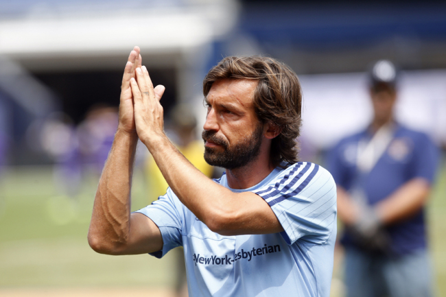 New York City FC's Andrea Pirlo (21), of Italy, acknowledges an ovation from the crowd as he walks off the field after warming up before an MLS soccer game against Orlando City SC at Yankee Stadium, Sunday, July 26, 2015, in New York. [Photo: AP]
