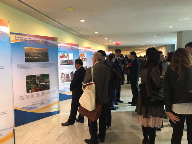 People visit a photo exhibition on China's Belt and Road Initiative at the UN headquarters in New York on May 8, 2017. [Photo: China Plus/Qian Shanming]