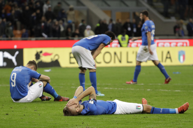 Italian players react to their elimination at the end of the World Cup qualifying play-off second leg soccer match between Italy and Sweden, at the Milan San Siro stadium, Italy, Monday, Nov. 13, 2017. [Photo: AP]