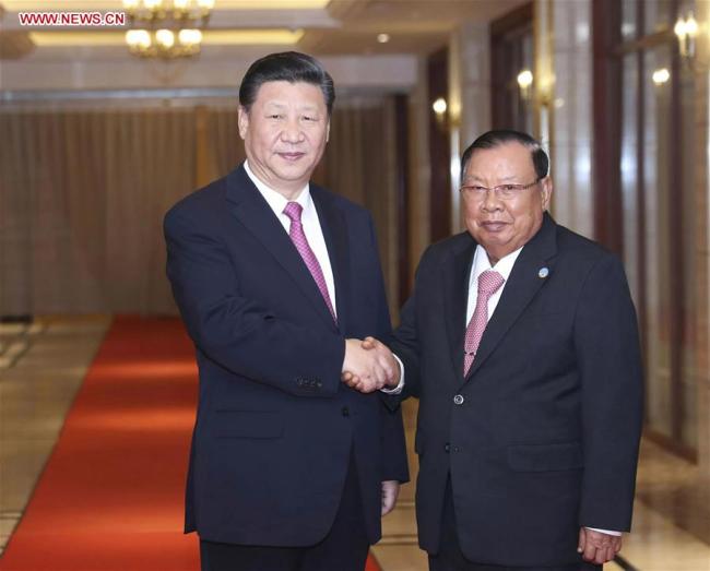 Chinese President Xi Jinping (L), also general secretary of the Communist Party of China Central Committee, meets again with Lao President Bounnhang Vorachit, also general secretary of the Lao People's Revolutionary Party Central Committee, in Vientiane, Laos, Nov. 14, 2017. [Photo: Xinhua]