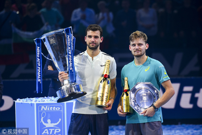 Winner, Grigor Dimitrov of Bulgaria and runner up David Goffin of Belgium hold their trophies following the singles final during day eight of the 2017 Nitto ATP World Tour Finals at O2 Arena on November 19, 2017 in London, England. [Photo: VCG]
