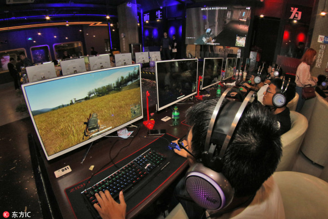 Young Chinese players play the online video game, PlayerUnknown's Battlegrounds, during an electronic sports competition in Yantai city, east China's Shandong province, 23 September 2017.[Photo: IC]
