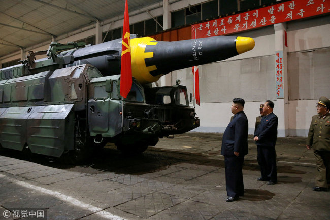 North Korean leader Kim Jong Un inspects the long-range strategic ballistic rocket Hwasong-12 (Mars-12) in this undated photo released by North Korea's Korean Central News Agency (KCNA) on May 15, 2017. [File Photo: VCG]