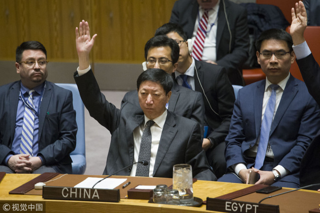 Wu Haitao, charge d'affaires of China's permanent mission to the United Nations, votes for a draft resolution on the status of Jerusalem in the United Nations Security Council on Monday, December 18, 2017. [Photo: VCG]
