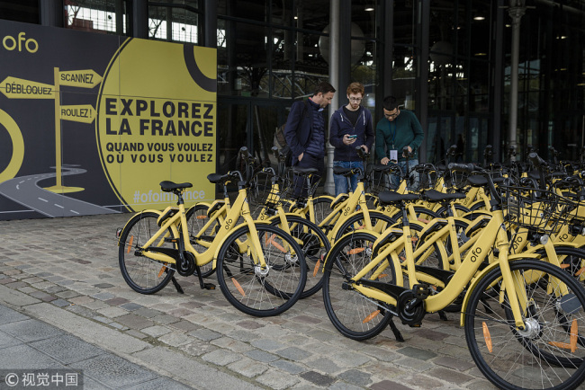 Rows of parked Ofo bicycles stand during a presentation at the Autonomy urban mobility summit in Paris, France, Oct. 19, 2017. [Photo: VCG]