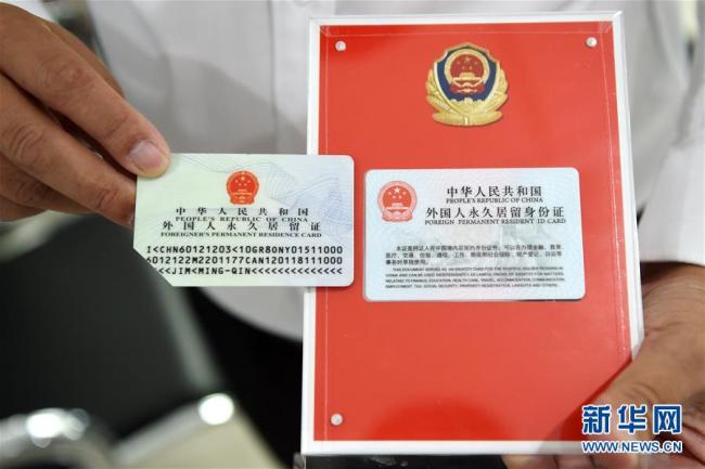 The new version permanent residence identity cards. [File photo: Xinhua]