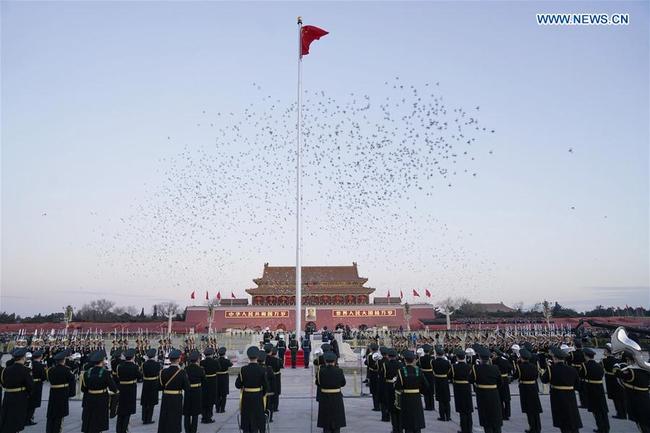 The Guard of Honor of the Chinese People's Liberation Army (PLA) perform the national flag-raising duty at the Tian'anmen Square in Beijing, capital of China, Jan. 1, 2018. The responsibility for guarding China's national flag and firing salute cannons at the Tian'anmen Square was transferred to the Chinese People's Liberation Army from Jan. 1, 2018, as authorized by the Central Committee of the Communist Party of China. Before Jan. 1, the ceremony was conducted by the armed police. [Photo: Xinhua/Shen Hong]