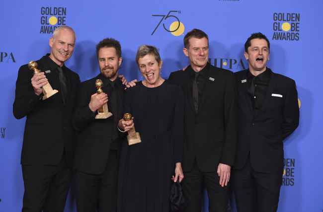 The cast and crew of "Three Billboards Outside Ebbing, Missouri" from left, Martin McDonagh, winner of the award for best screenplay - motion picture, Sam Rockwell, winner the award for best performance by an actor in a supporting role in any motion picture, Frances McDormand, winner of the award for best performance by an actress in a motion picture - drama, and Graham Broadbent and Peter Czernin, pose in the press room with the award for best motion picture - drama at the 75th annual Golden Globe Awards at the Beverly Hilton Hotel on Sunday, Jan. 7, 2018, in Beverly Hills, Calif. [Photo: Invision/AP/Jordan Strauss]