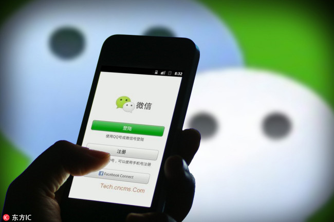 Undated photo shows a mobile phone user uses the messaging app WeChat. [Photo: IC]