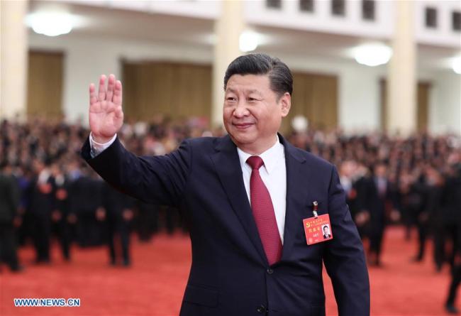 Xi Jinping, general secretary of the Communist Party of China Central Committee, who is also Chinese president and chairman of the Central Military Commission, meets with delegates, specially invited delegates and non-voting participants of the 19th CPC National Congress at the Great Hall of the People in Beijing, Oct 25, 2017. [File Photo: Xinhua]