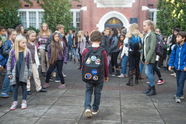 In the 2017 film adaptation of Wonder, students dart away in the face of Auggie. [Photo:IC]