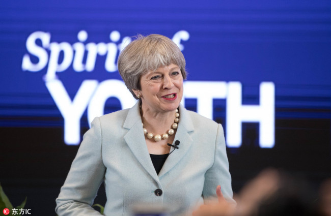 Visiting British Prime Minister Theresa May speaks during a youth festival exhibition at Wuhan University in Wuhan, capital of Hubei Province, January 31, 2018. [Photo: IC] 
