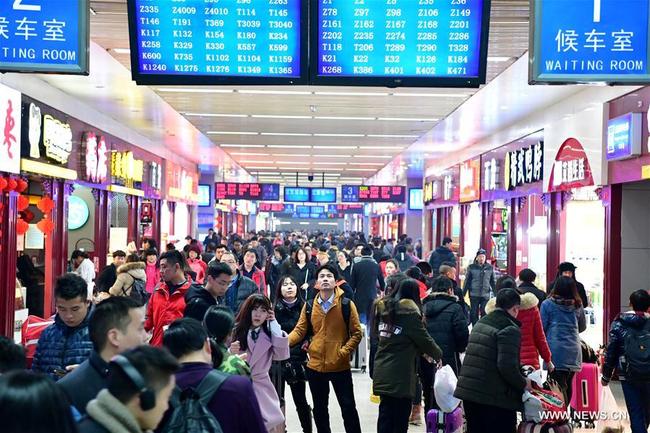 Passengers prepare to travel by train at a railway station in Zhengzhou, capital of central China's Henan Province, Feb. 2, 2017. China's railways carried a record number of passengers during the seven-day Lunar New Year holiday. A total of 51.99 million passengers traveled by train during the Spring Festival break, an increase of 8.8 percent from a year earlier, according to China Railway.[Photo:ChinaPlus]