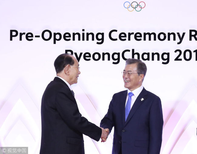 South Korean President Moon Jae-in (R) shakes hands with Kim Yong Nam, president of the Presidium of the Supreme People's Assembly of the DPRK, at a reception in PyeongChang county in eastern South Korea, February 9, 2018. [Photo: VCG]