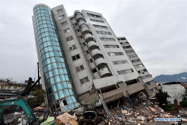 A collapsed building is seen in quake-hit Hualien County, southeast China's Taiwan, Feb. 7, 2018. [File Photo:Xinhua]