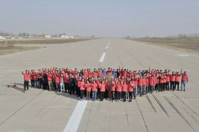 Chinese researchers celebrate a successful test flight of the new Skyhawk stealth drone in this undated photo. [Photo: China Aerospace Science and Industry Corporation]