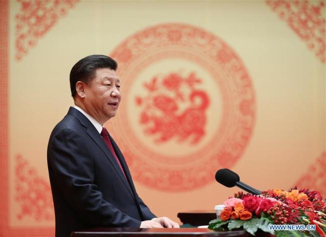 Chinese President Xi Jinping, also general secretary of the Communist Party of China (CPC) Central Committee and chairman of the Central Military Commission, delivers a speech to a festival reception at the Great Hall of the People in Beijing, capital of China, Feb. 14, 2018. Xi Jinping, on behalf of the CPC Central Committee and the State Council, extended Spring Festival greetings to all Chinese people Wednesday. [Photo: Xinhua]