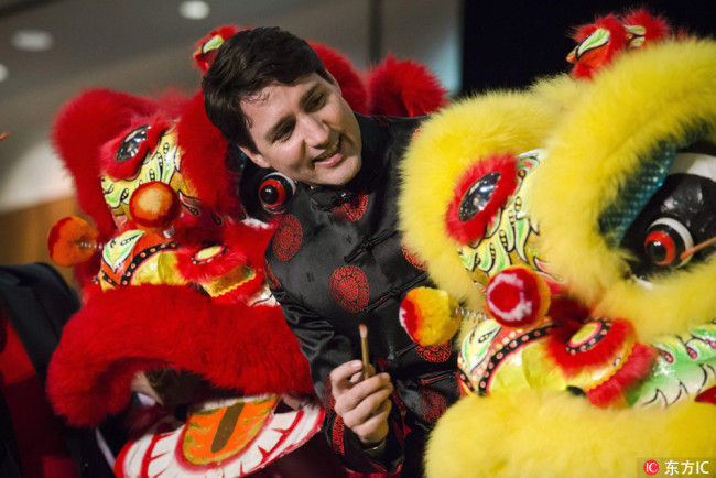 Prime Minister Justin Trudeau takes part in the "Eye-Dotting" ceremony as part of a lunar new year celebrations with Liberal members of parliament, supporters, and community leaders, in Markham, ON, Canada on Thursday, February 15, 2018.[Photo: dfic.cn]