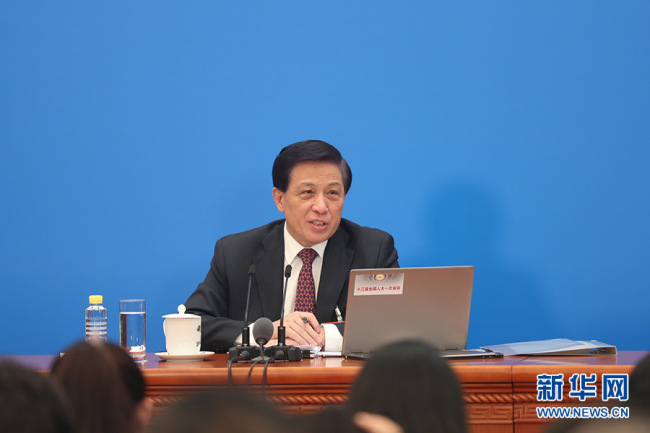 Zhang Yesui, spokesman for the first session of the 13th National People's Congress (NPC), holds a press conference in Beijing on March 4, 2018. [Photo: Xinhua]