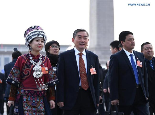 Deputies to the 13th National People's Congress (NPC) walk to the Great Hall of the People for the opening meeting of the first session of the 13th NPC in Beijing, capital of China, March 5, 2018. (Xinhua)
