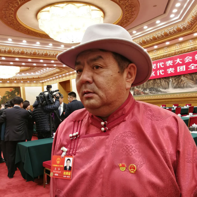 Meng He, Inner Mongolian deputy to the 13th National People's Congress (NPC), is interviewed in Beijing, on March 5, 2018. [Photo: China Plus]