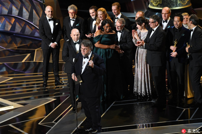 Guillermo del Toro, director of The Shape of Water, accepts the Oscar for best motion picture of the year during the 90th Academy Awards, Mar. 4, 2018. [Photo: IC] 