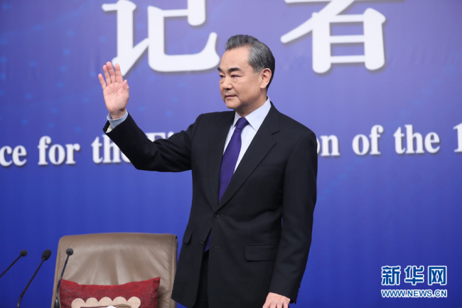 Chinese Foreign Minister Wang Yi meets the press at a news conference in Beijing, on on the sidelines of the national legislature's annual session on March 8, 2018. [Photo: Xinhua]