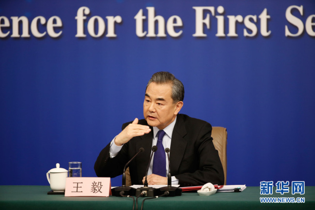 Chinese Foreign Minister Wang Yi answers questions on China's foreign policy and foreign relations at a press conference for the first session of the 13th National People's Congress in Beijing, capital of China, March 8, 2018.[Photo: Xinhua]