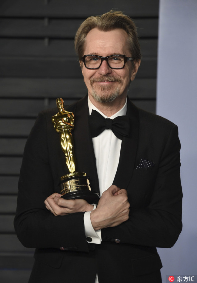 Actor Gary Oldman, winner of the Academy Award for best performance by an actor in a leading role for "Darkest Hour", arrives at the Vanity Fair Oscar Party on Sunday, March 4, 2018, in Beverly Hills, Calif.