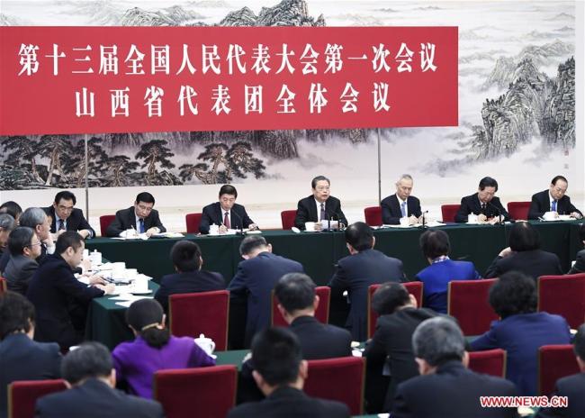 Zhao Leji, a member of the Standing Committee of the Political Bureau of the Communist Party of China (CPC) Central Committee, joins a panel discussion with the deputies from Shanxi Province at the first session of the 13th National People's Congress in Beijing, capital of China, March 8, 2018. [Photo: Xinhua/Yan Yan]