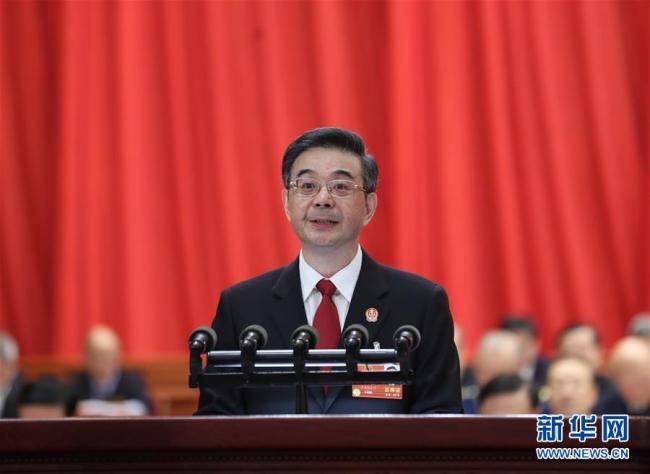 Zhou Qiang, Chief of the Supreme People's Court, delivers a report at a plenary meeting of the on-going first session of the 13th National People's Congress on March 9, 2018. [Photo: Xinhua]