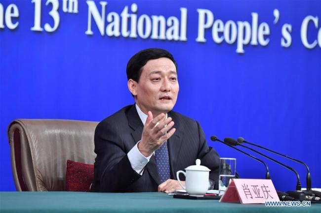 Xiao Yaqing, head of the State-owned Assets Supervision and Administration Commission (SASAC), answers questions at a press conference on reform and development of state-owned enterprises on the sidelines of the first session of the 13th National People's Congress in Beijing, capital of China, March 10, 2018. [Photo: Xinhua]